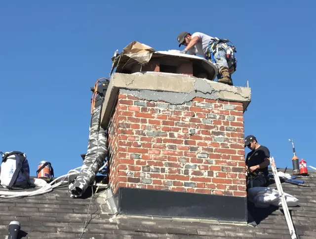 Enfield Chimney Sweep installing a custom chimney crown in Enfield, CT