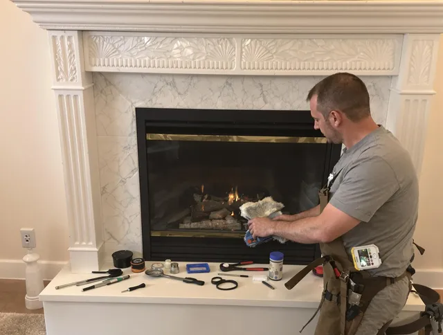 Enfield Chimney Sweep performing fireplace maintenance in Enfield, CT