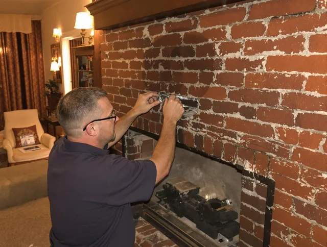Enfield Chimney Sweep expert fixing a fireplace in Enfield, CT